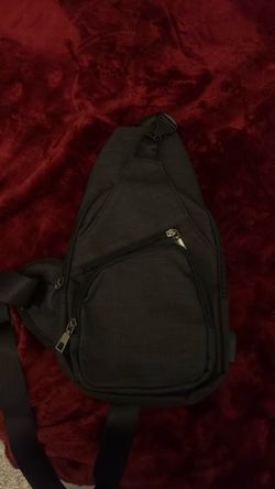 One strap back pack that has a charger port so you can charge your phone or whatever with the bag