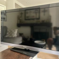 Sony Bravia 52” LCD TV, Amazon TV Firestick, two remotes