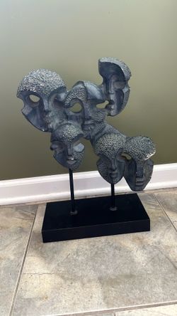 Black Stone artwork of 6 heads abstract art on wood pedestal
