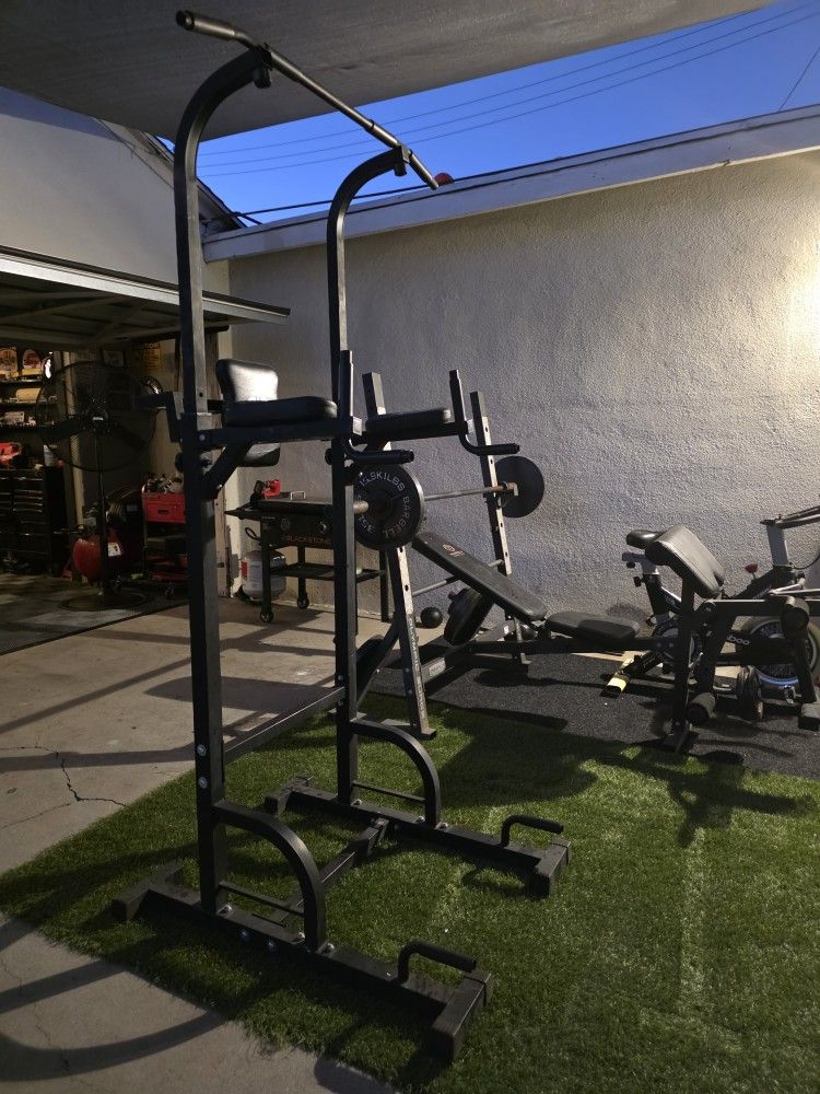  marcy bench with bar and weights also a power bar for pull ups and dips 
Gym Equipment 