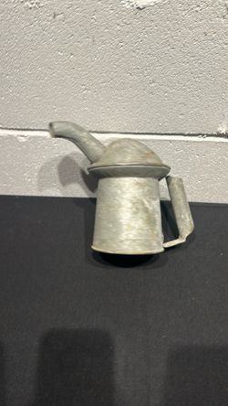 Vintage galvanized metal oil can