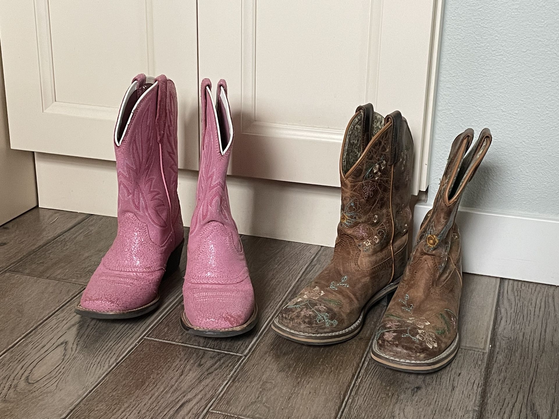 Pink Ariat and brown Smoky Mountain Boots 