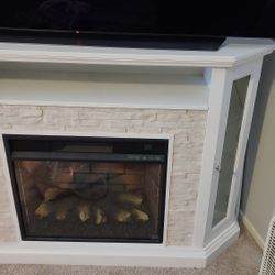 Vanegas Corner TV Stand for TVs up to 55" with Fireplace Included