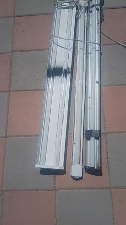 Fluorescent LED light fixtures