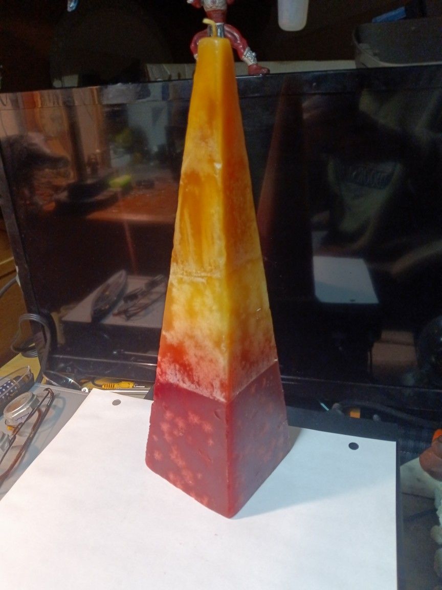 12 Inch Pyramid Shaped Candle Orange & Red.