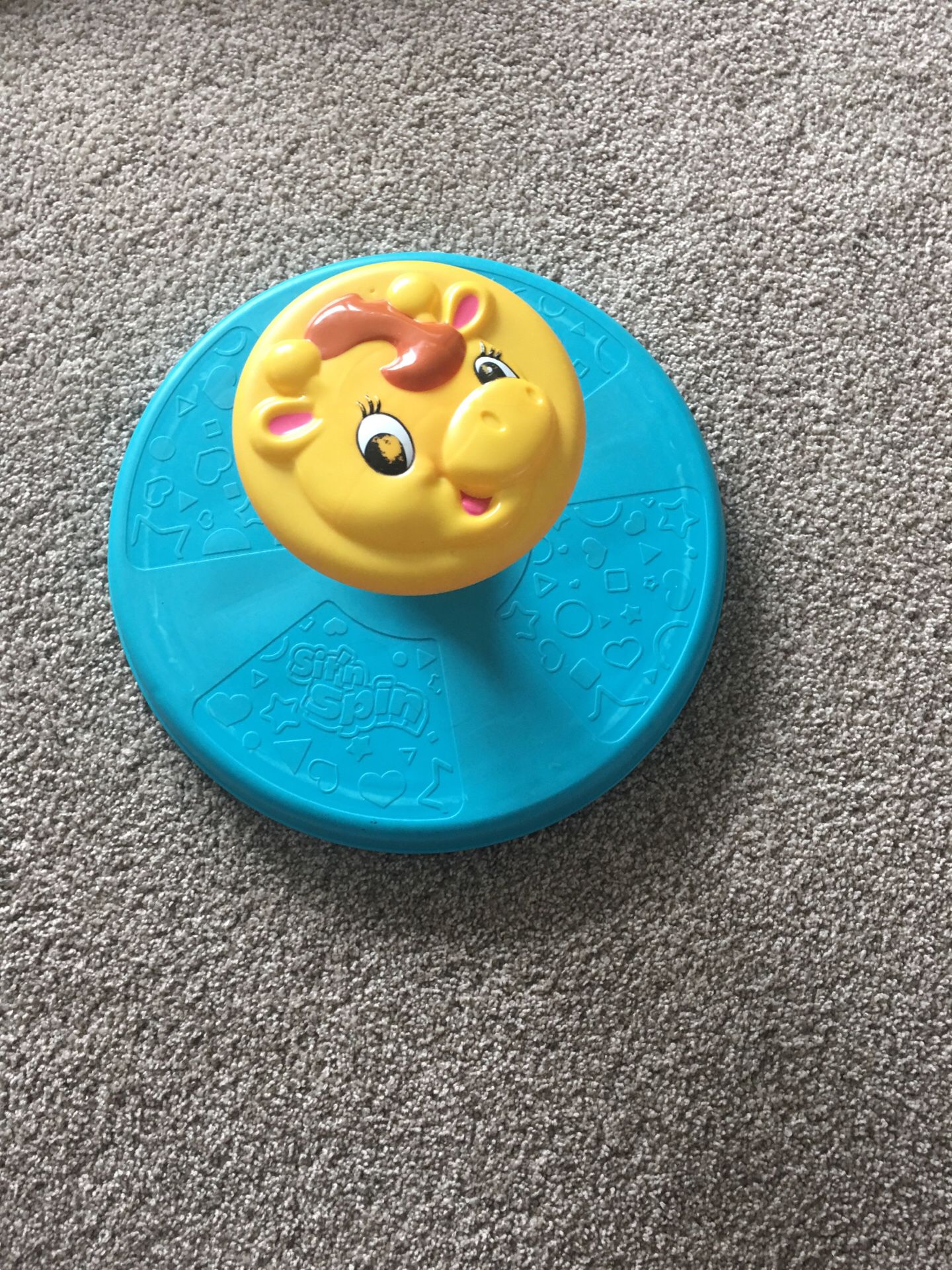Sit and spin toy