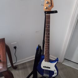 Peavey 4 String Bass GUITAR WITH GIG BAG AND STAND.  $200.00