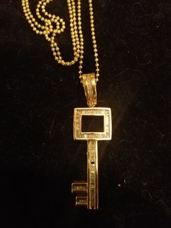 Diamond skeleton key pendant with baguettes