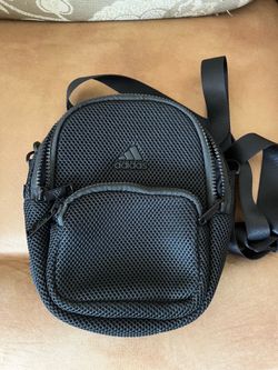 Convertible Mini Backpack-Crossbody Bag featuring a textured mesh exterior and a tonal Adidas logo