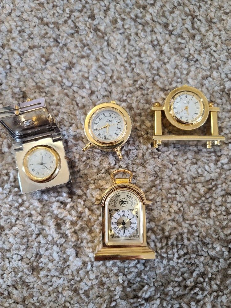 collection,four mini brass clocks, shadow box items