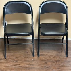 2 metal fold out chairs