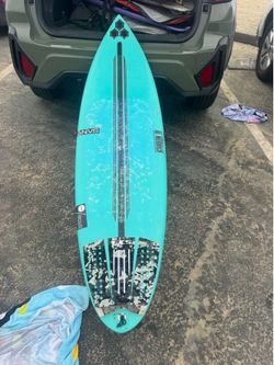 Al Merrick happy surfboard
