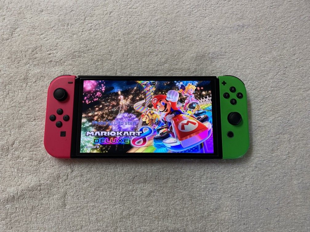NINTENDO SWITCH OLED + 125 SWITCH GAMES MARIO KART,MARIO PARTY,MARIO 3D WORLD,LUIGIS MANSION,ZELDA,POKEMON Z-A and More