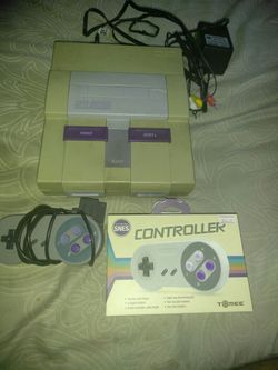 Super nes with two remotes and {url removed} games.just the system and cords and remotes.works great