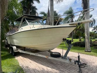 FREE Pursuit 26’ walk around boat 1988y. Title. New transom. No soft spots. NO TRAILER included.