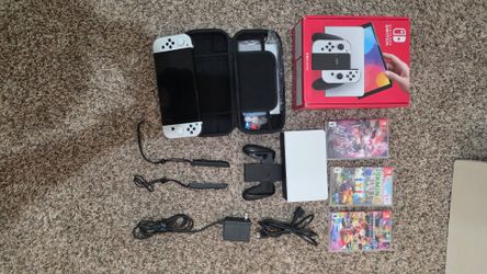 Nintendo Switch OLED international edition + 3 games + protector + carrying case