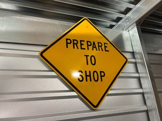 metal life size "Prepare to shop" road sign