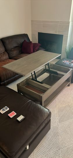 Lift top coffee table with storage and shelf