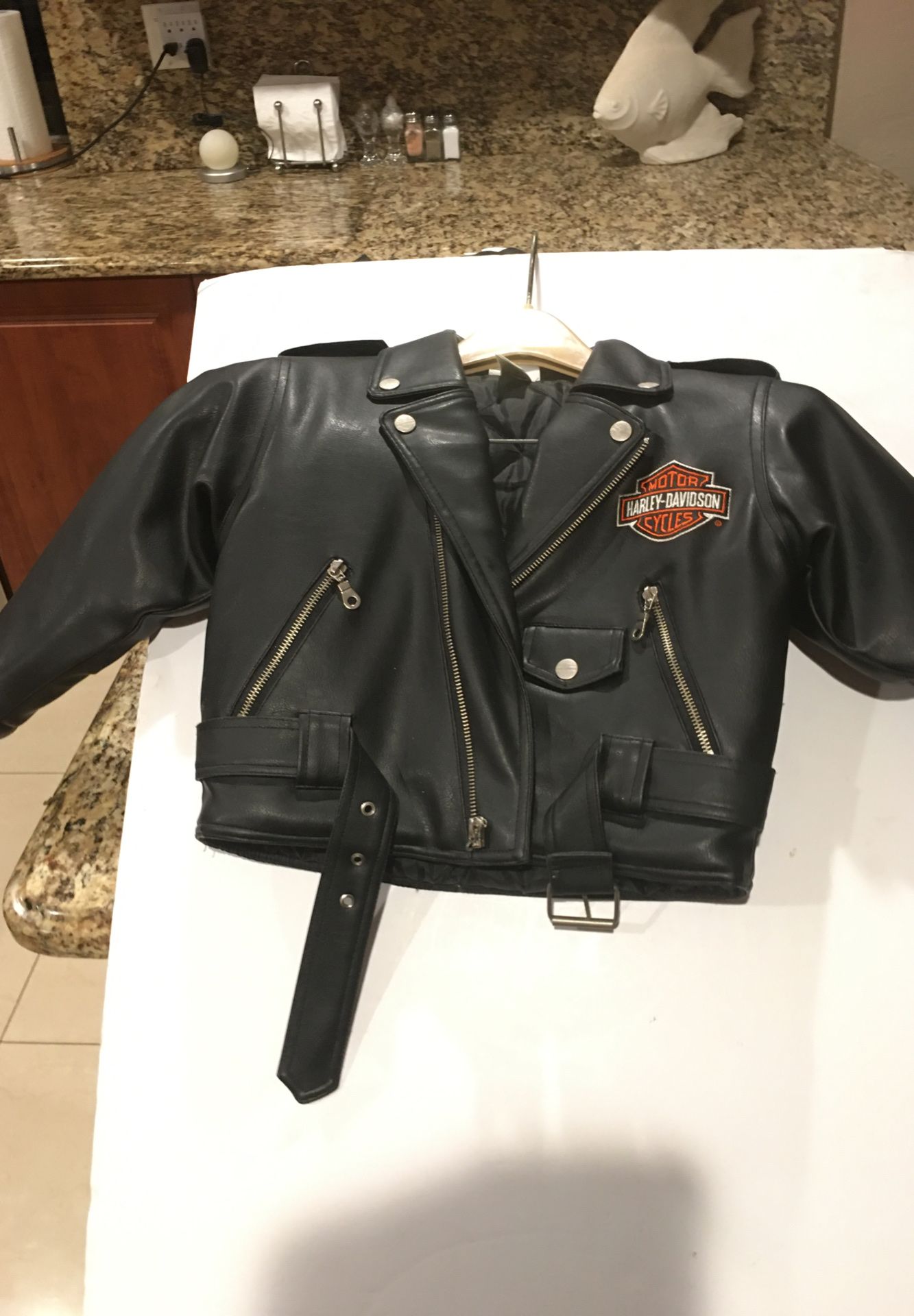Childs leather Harley Davidson motorcycle jacket, size 5, never worn, excellent condition.