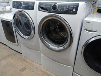 Electrolux front load washer and dryer set on pedestals - Free delivery