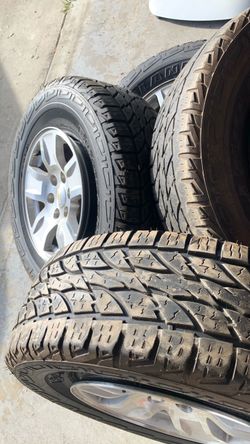 Chevrolet Silverado rims and tires with lug nuts