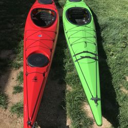 Two 14' Touring Kayaks, Two Splash Skirts, Two Paddle Floats, and Two Pairs of Roof Racks