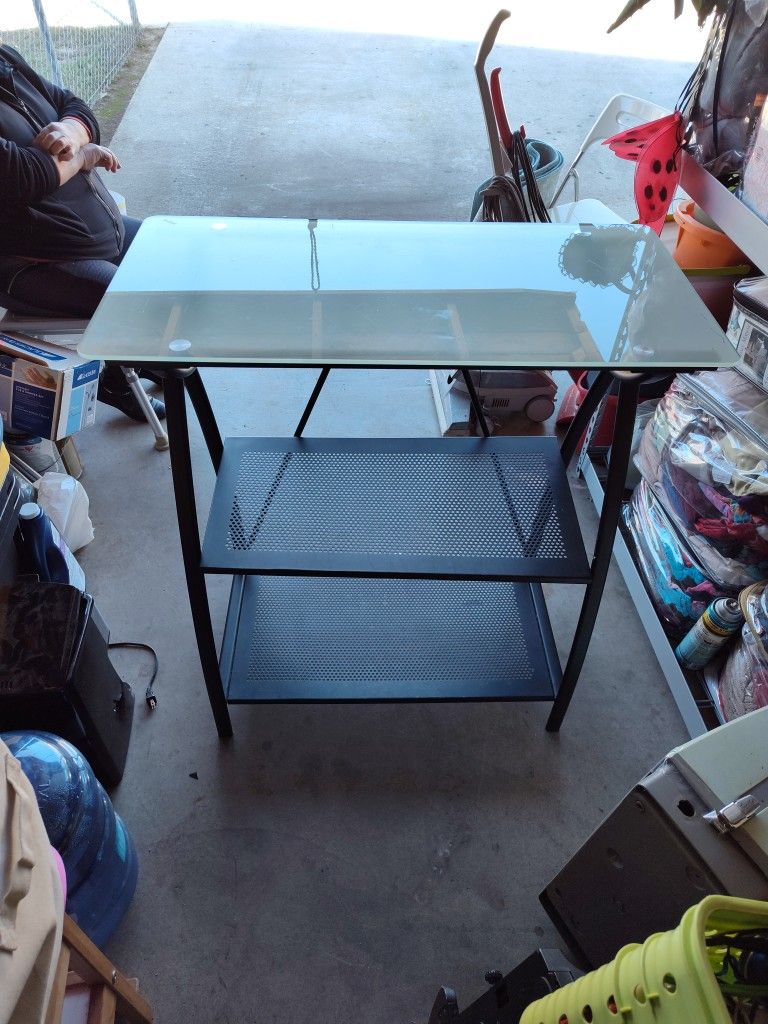 The Top Side Is Glass And The Bottom Is Metal Desk