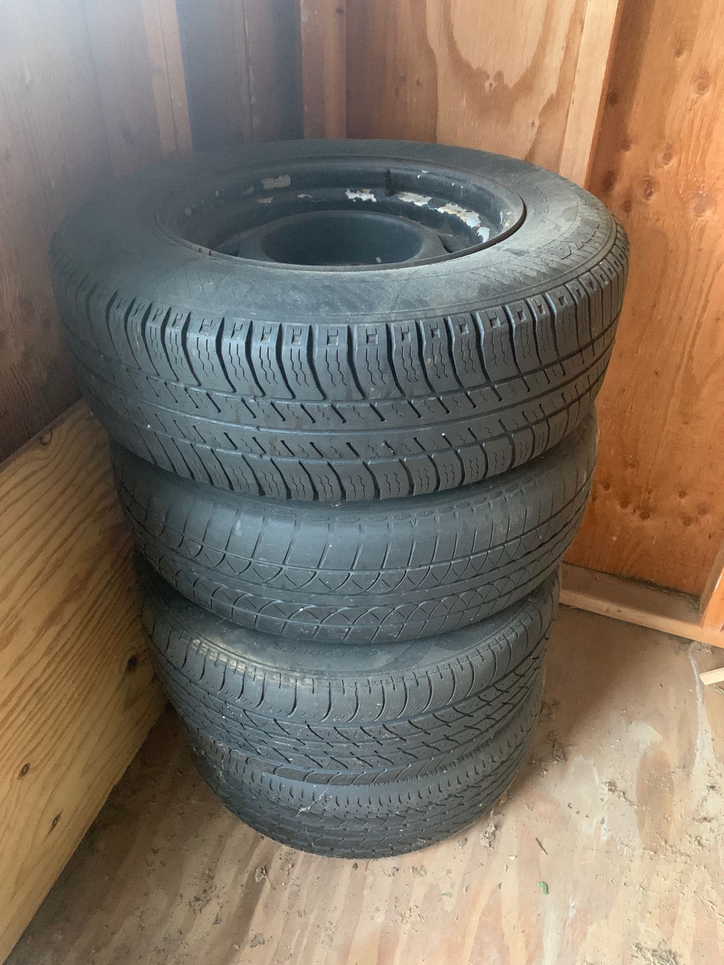 (4) - 15” Rims & Tires , no rust, dents. Holds Air.