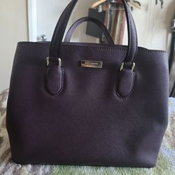 Kate Spade satchel purse  Cherrywood burgundy red shade. Three compartments with center zipper closure, front and back Good Condition