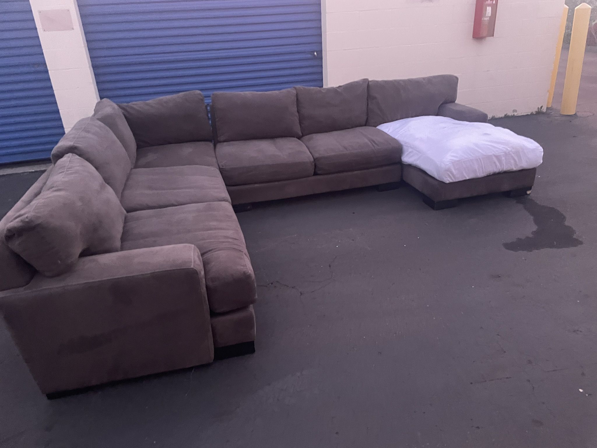 Gray Living Spaces 4 piece sectional couch. Missing 1 Cushion Cover
