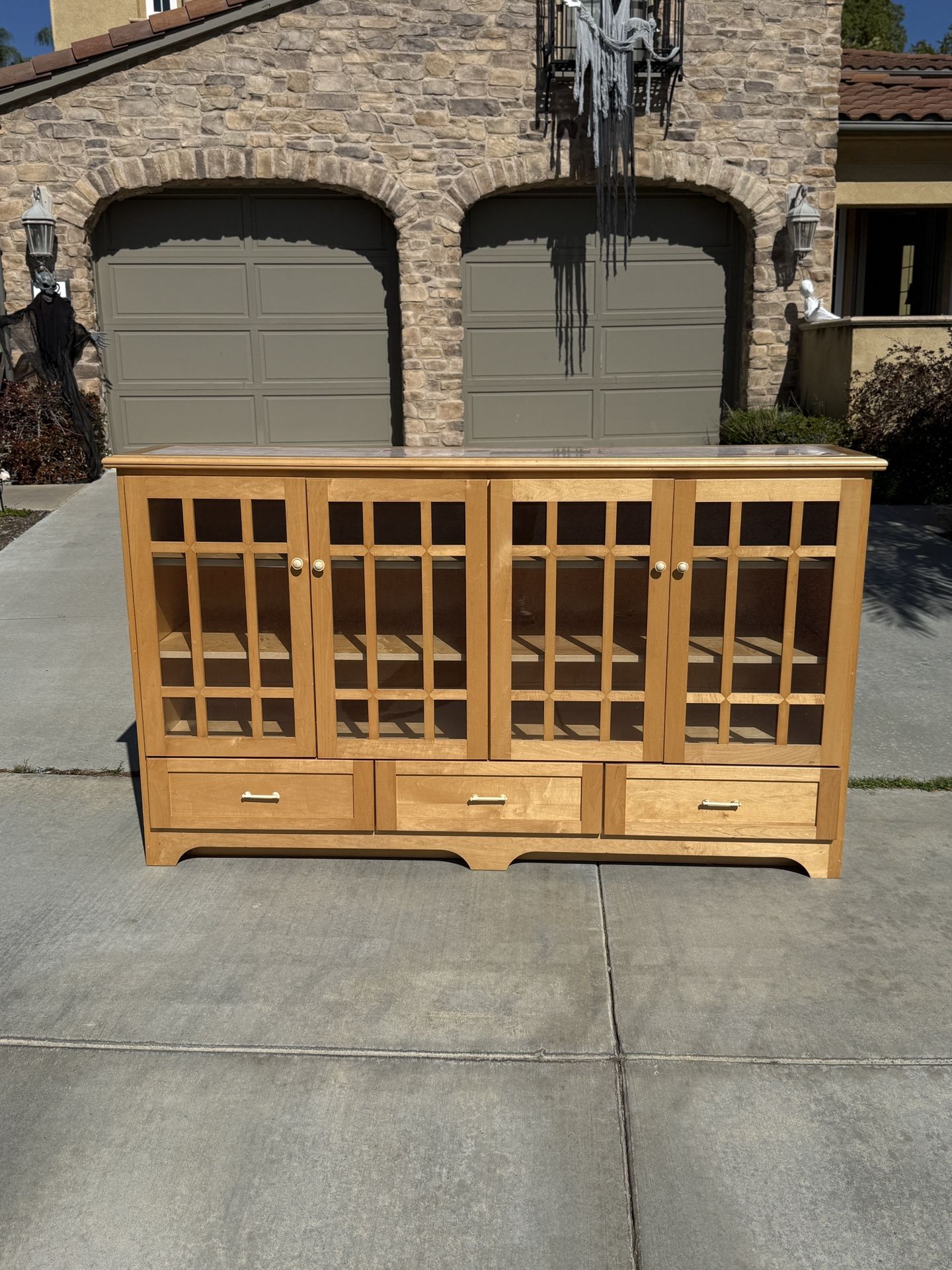 Acadian style wood storage cabinet