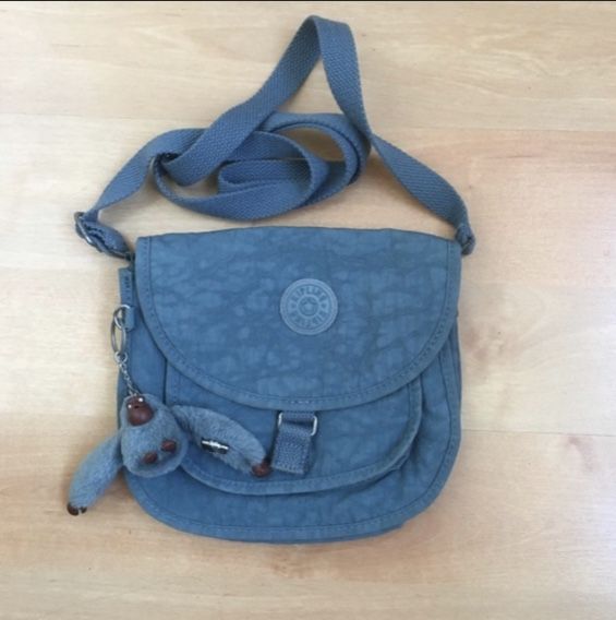 Like New small Crossbody purse Kipling brand color blue.