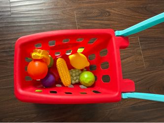 Toddler shopping cart with veggies/fruits