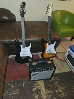 2 electric guitars with fender champions II amp