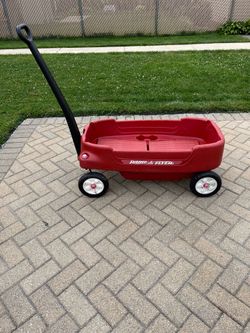 Radio flyer red plastic two seat, passenger wagon with fold down seats