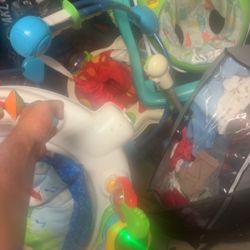 Baby Jumpers And Walker With A Big Tote Of Baby Boy Clothes And Giant Foldable Play Pen