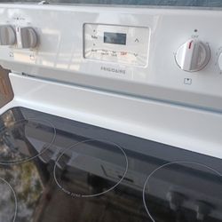 Frigidaire glass top range stove.
