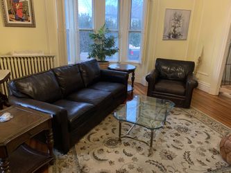 Boston Interiors Top Grain Leather Couch and Spinner Chair.