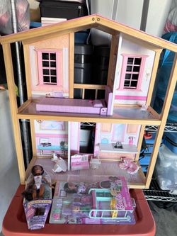 Playhouse with Barbies included