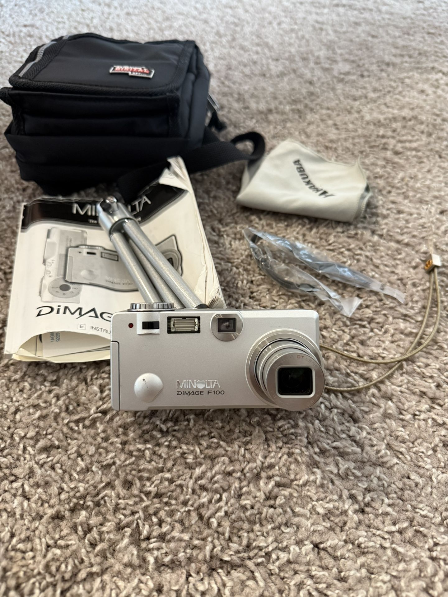 Minolta DiMAGE F100 Camera – Works Great + Case, Tripod, Manual