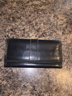Black leather Coach wallet with white stitching