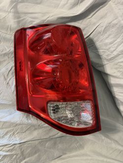 2011-2020 Dodge Caravan driver side (left) tail light. 