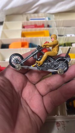 Vintage Hot Wheels 1971 Rrrumblers Mean Machine Chopper with rider and bottom wheels.