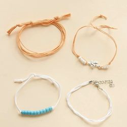 Beautiful NEW 4 piece coral charm, bead and string detail bracelet set