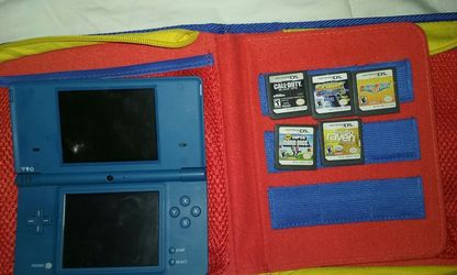 Nintendo Dsi with 5 games comes with super mario bros. Case and charger