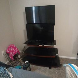 2 TVs And Glass Wooden Stand 