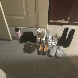 Used Shoes And A Water Bottle