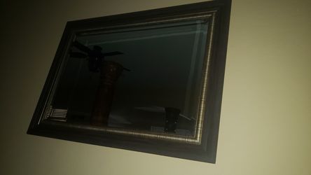Mirror for sale with brown wood trim