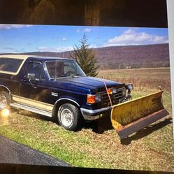 7 foot snow, plow blade, hydraulic lift with controls.