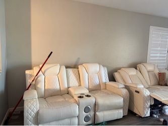 White leather sofa and movie theater loveseat